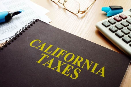 California Voluntary Disclosure Program concept with a book reading “California taxes” sitting on a desk.