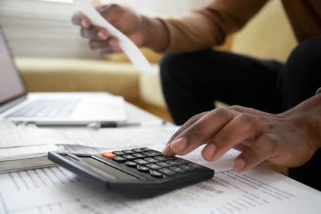 A man filling out tax paperwork for the voluntary disclosure program in Nevada.