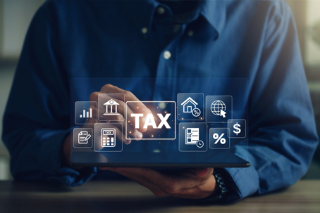 E-tax, A Businessman using a tablet to fill in the income tax online return form for payment.Calculation of tax return.Government, state taxes. Data analysis, paperwork, financial research, reports.